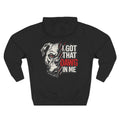 A black long-sleeve hoodie shown from the back, featuring a graphic print of a white pitbull-type dog with one red eye and the text 'I GOT THAT DAWG IN ME' in white and red.